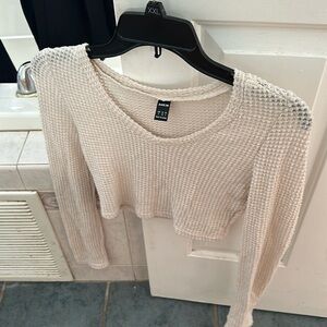 Cropped light sweater to wear over tank top